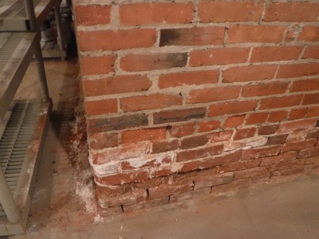 Failing brick support wall